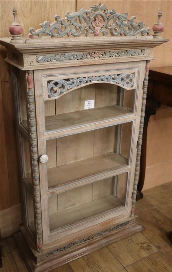 An Indian carved teak cabinet W.58cm